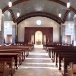 Curved beams, reredos, and window, wall, and door trim in St. Anne Catholic Church - Richmond Hill, GA