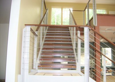 Ipe and maple stair treads with Ipe handrail